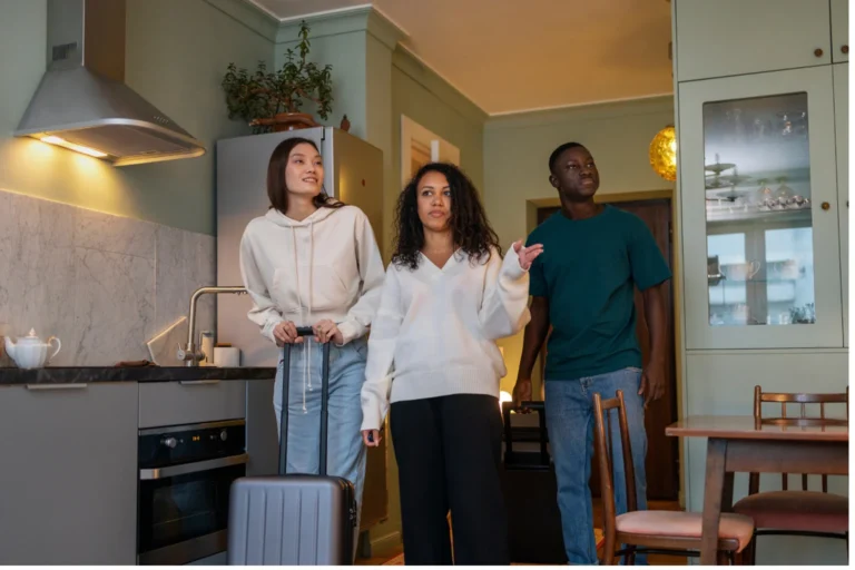Happy roommates who find a housemate in Stoke on Trent using smart living and budget-friendly rental solutions